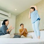 asian-senior-grandparents-couple-laying-with-grandchildren-preety-female-child-bed-bedroomhappy-family-play-together-bed_609648-262